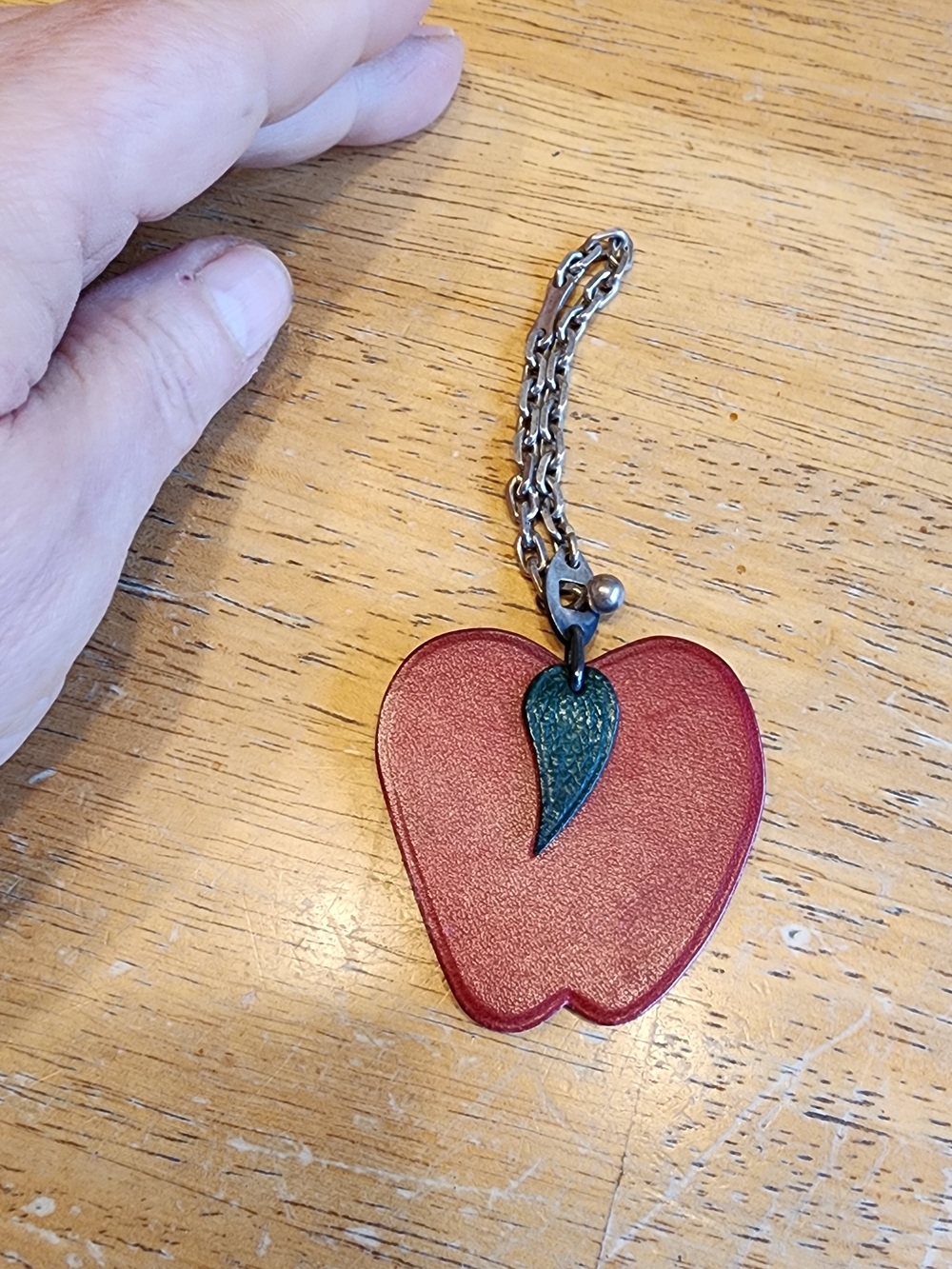 Hermès Swift Apple Bag Charm in red leather with a green leaf trim